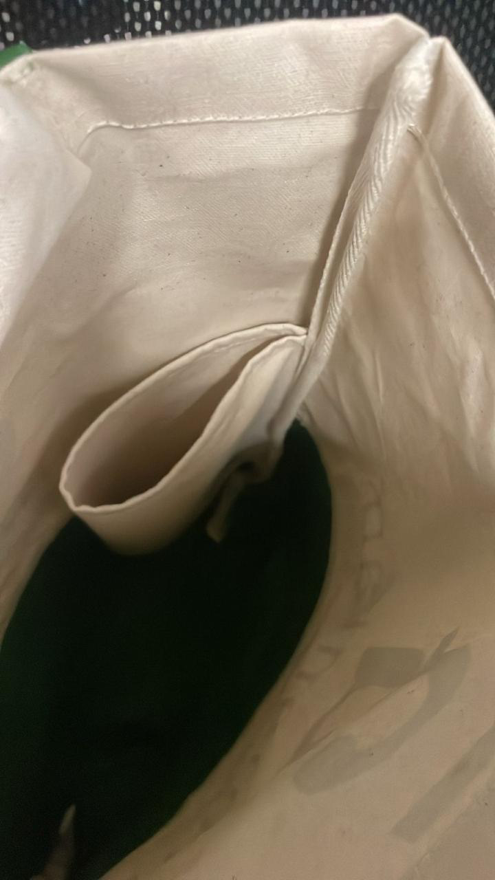 Water-bottle holder fitted inside a Tigris tote bag.